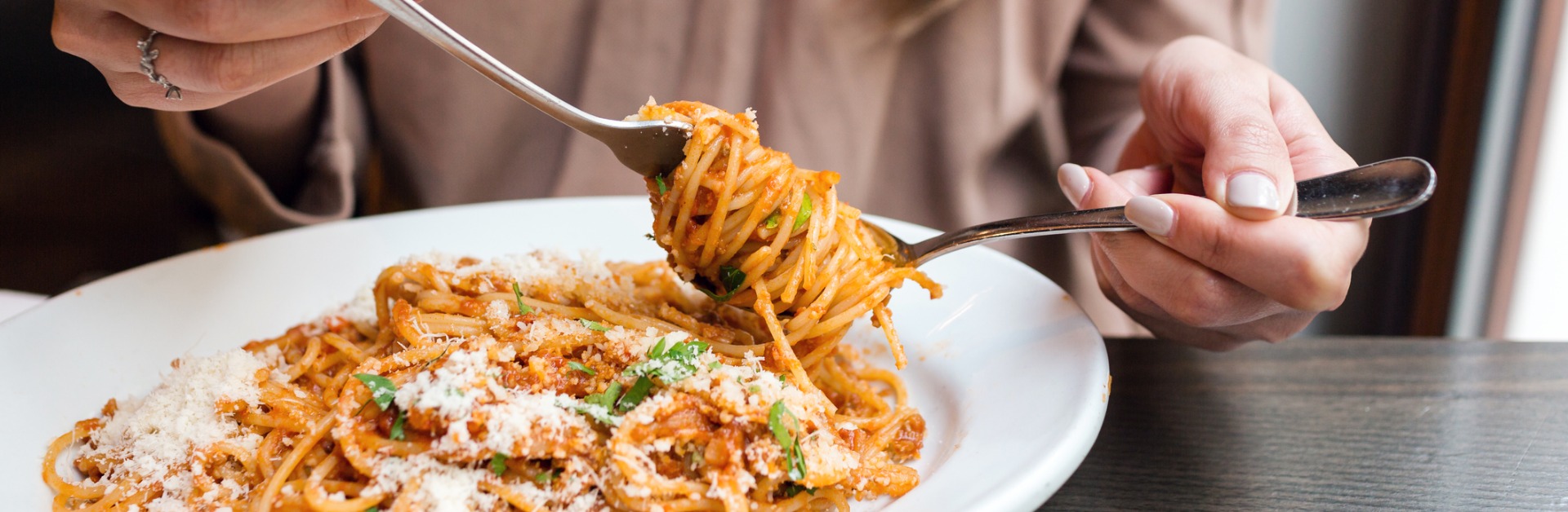 girl eats italian pasta with tomato meat closeup spaghetti bolognese picture id689346606